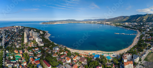 Panorama of Gelendzhik resort from a height  the Black Sea. The Gelendzhik Bay  the Caucasus Mountains are visible. Along the bay there are resort beaches  sanatoriums and boarding houses