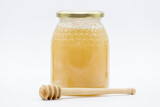 honey jar and wooden honey spoon