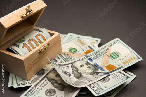 money dollars in a wooden box