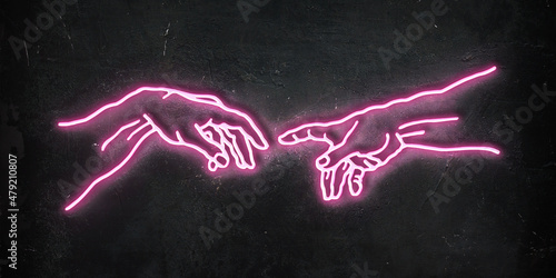 Concept illustration of pink neon illuminated sign illustration of reaching hands isolated on black wall background.