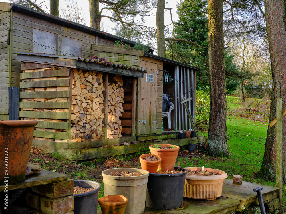 January, and the log store and dormant garden utensils on the moorland smallholding January, and the log store and dormant garden utensils on the moorland smallholding