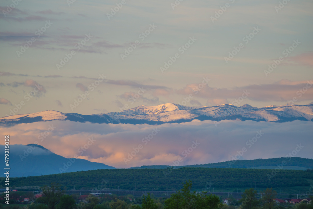 cover with snow mountains in the morning