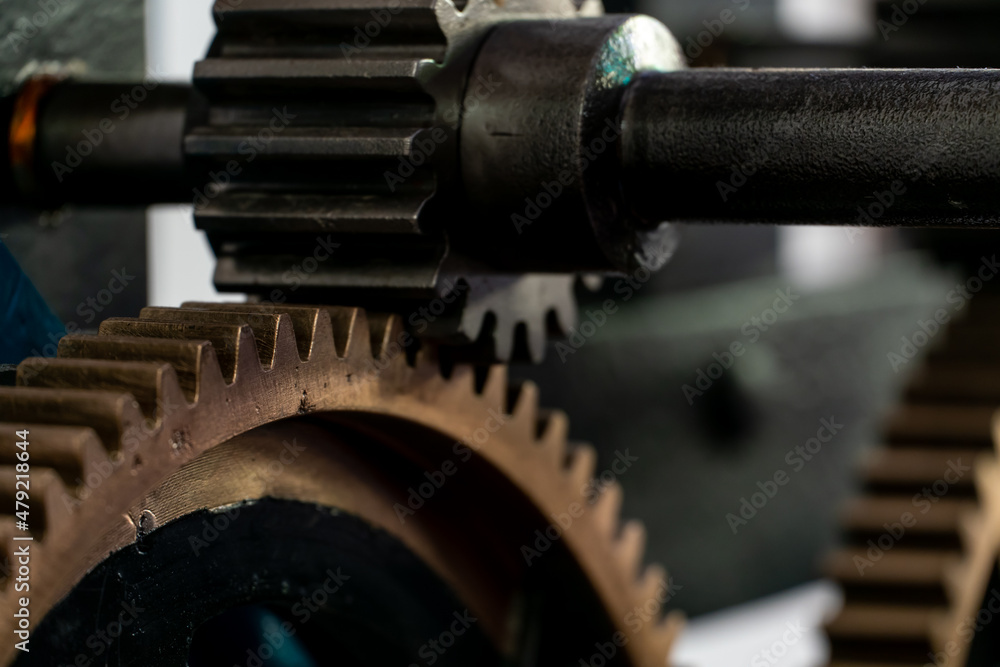 Church clockwork. The gear mechanism of a large old tower clock. Antique large clock mechanism with gears and cogs after restoration Church clockwork. The gear mechanism of a large old tower clock. Antique large clock mechanism with gears and cogs after restoration