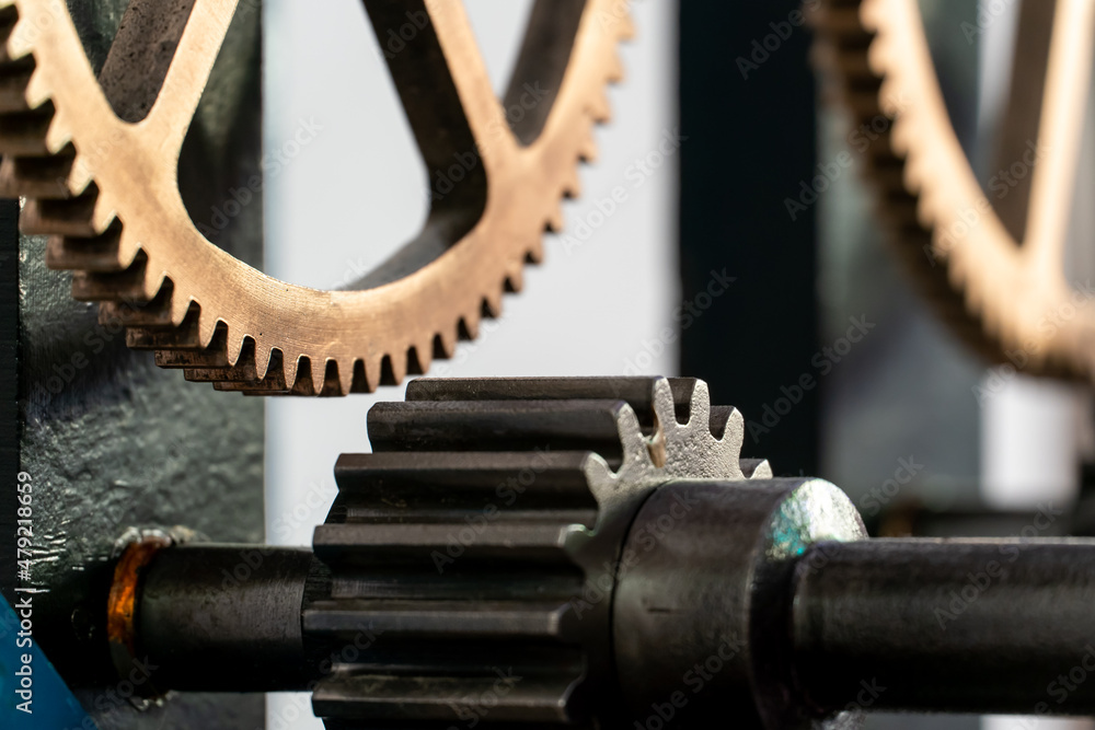 Church clockwork. The gear mechanism of a large old tower clock. Antique large clock mechanism with gears and cogs after restoration
