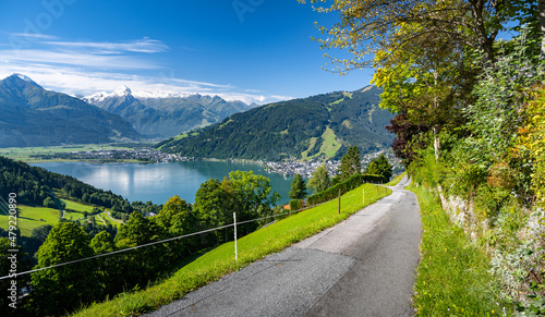Impressive mountain road in Zell am See, in the background the Zeller See and the snow-covered Kitzsteinhorn, Salzburg, Austria, Europe photo