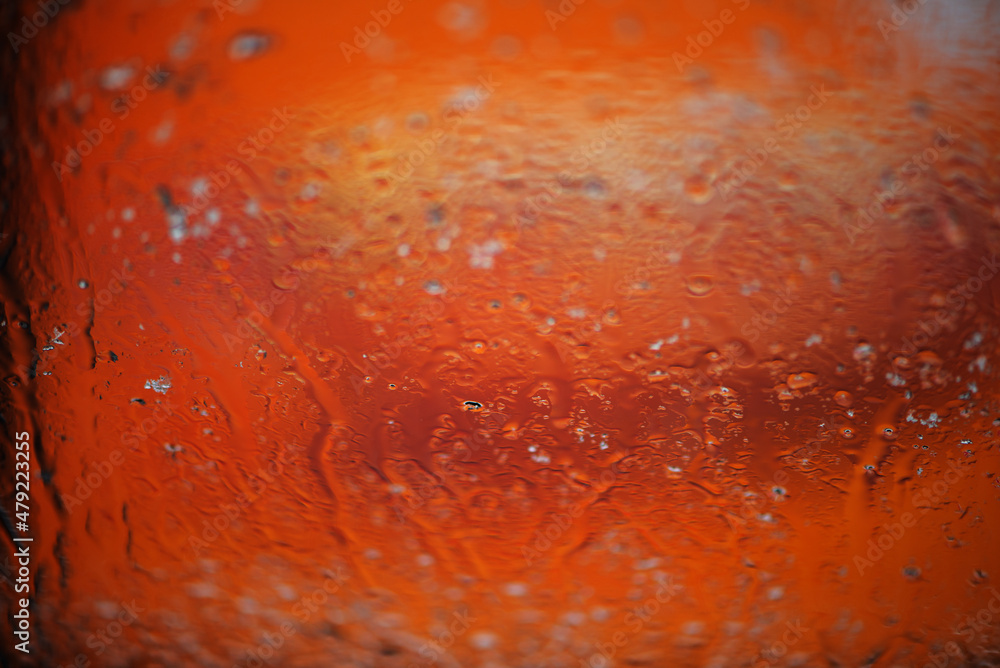 Abstract background with rain drops and snowflakes on car window, wet glass, rainy day. Abstract background with rain drops and snowflakes on car window, wet glass, rainy day.