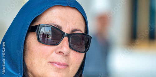 Happy caucasian female visit a islamic Mosque.