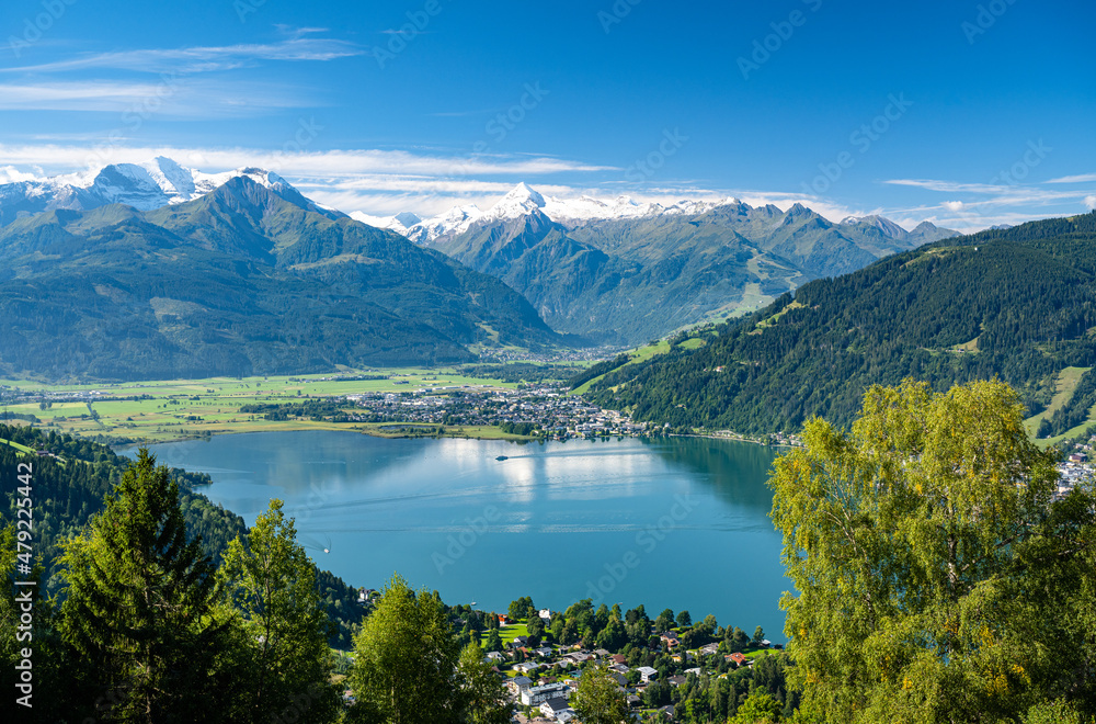 Ship sails over the idyllic lake Zell am See in a summer alpine landscape in the Salzburger Land, Zell am See, Austria, Europe