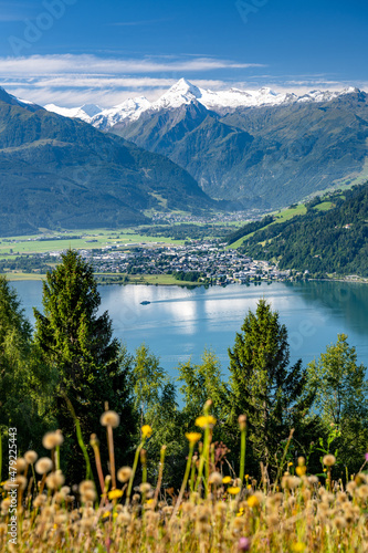 Ship sails over the idyllic lake Zell am See in a summer alpine landscape in the Salzburger Land, Zell am See, Austria, Europe
