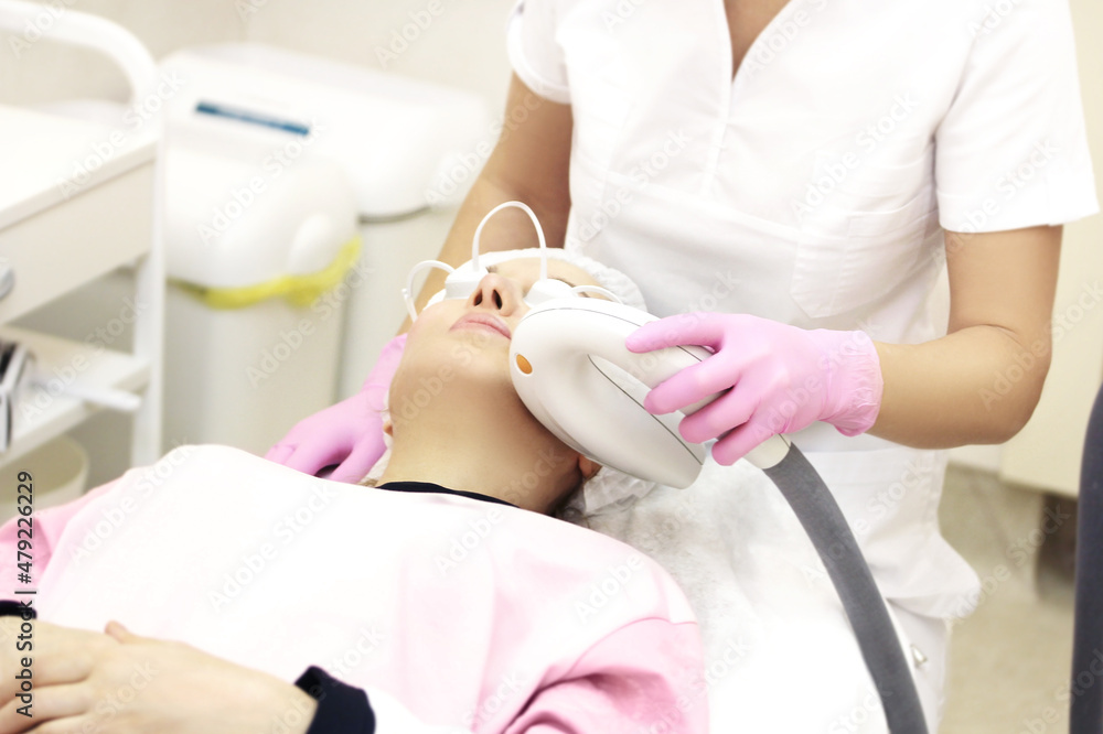 Obraz premium Photorejuvenation,Cosmetic Laser Dermatology ,dermatologist offices,laser technology.