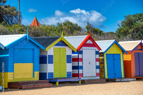Colorful huts in Brighton Beach on a sunny morning, Australia.