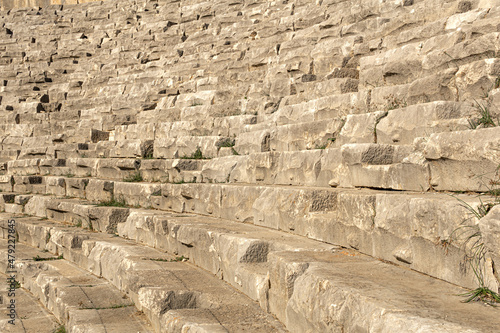 old stone steps - tribunes of ruined ancient amphitheate in Myra, Turkey photo