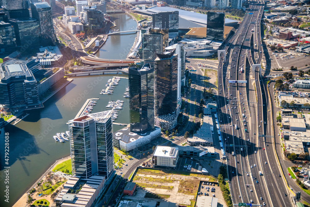 Fototapeta premium MELBOURNE, AUSTRALIA - SEPTEMBER 8, 2018: Aerial city skyline from helicopter. Downtown and Yarra river.
