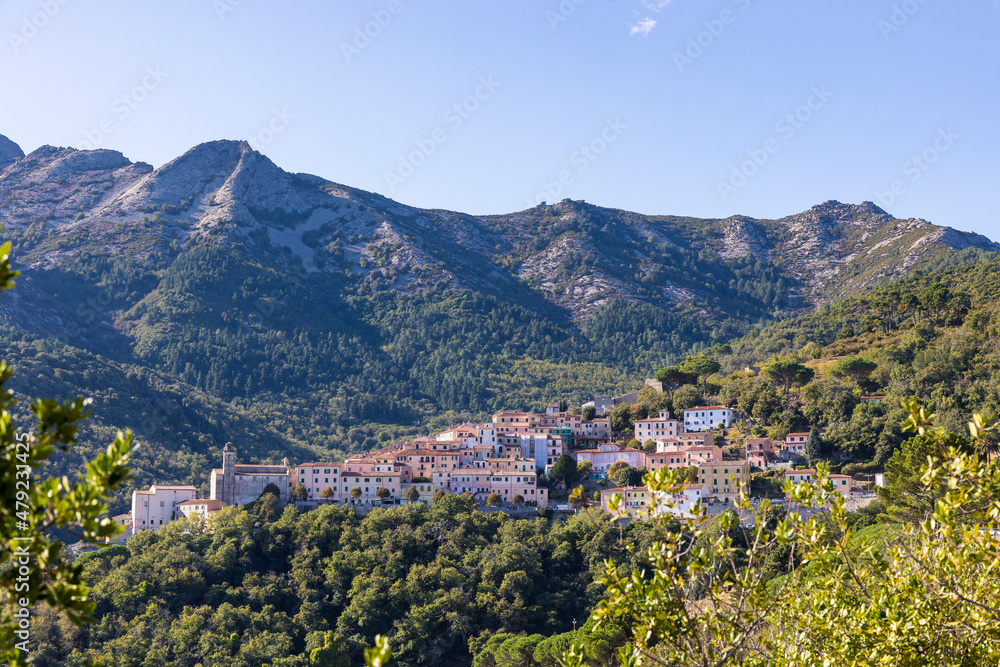 View of the village of Poggio in the mountains of the island of Elba in Italy under a bright blue sky in summer