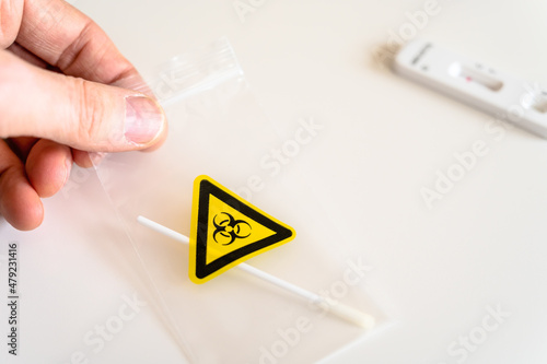 Man with bacteriological bag containing Covid sample