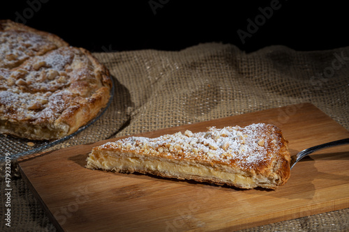 Pantxineta, puff pastry cake with pastry cream decorated with almonds and icing sugar, traditional Basque Country dessert