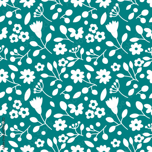 Seamless floral pattern in white and green colours. Repetitive background with different flowers, leaves and branches. Backdrop with plants drawn in a simple and modern style. Surface design.