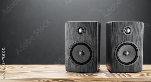 Music speakers on the right on the bookshelf. Free space for your design. Professional wooden bookshelf speaker has a classic, elegant look. 3D rendering