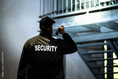 Security Guard Walking Building Perimeter
