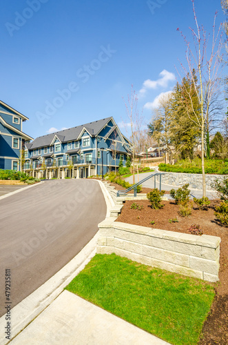A perfect neighbourhood. Houses in suburb at Spring in the north America. Luxury houses with nice landscape. © karamysh