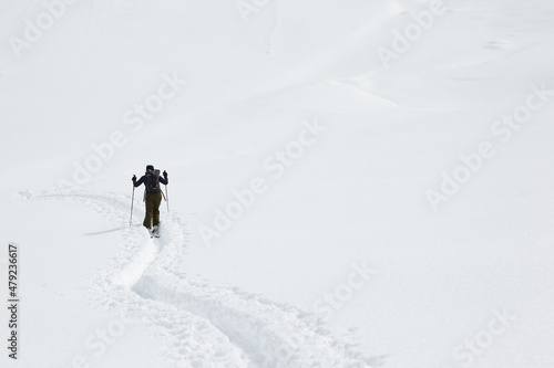 women Skitouring in deep fresh snow