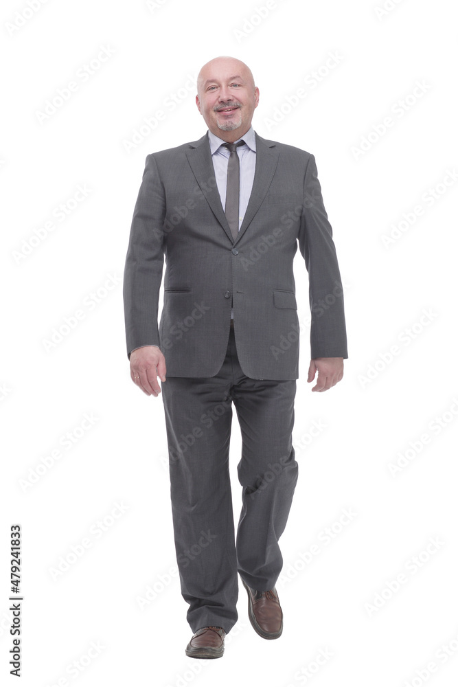 Mature business man striding forward .isolated on a white background. Mature business man striding forward .isolated on a white background.