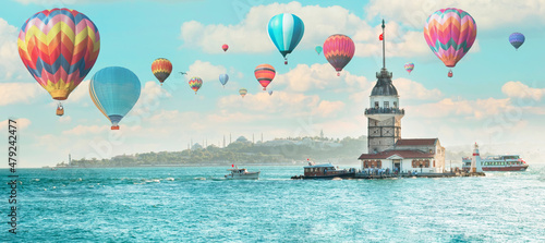 Obraz na plátně Hot air balloon flying over spectacular Maiden's Tower in istanbul, Turkey (KIZ