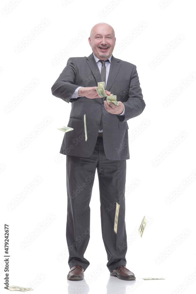 in full growth. smiling business man with dollar bills. in full growth. smiling business man with dollar bills.