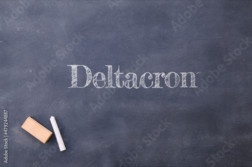 Deltacron written on a blackboard. Mix of Delta and Omicron variants