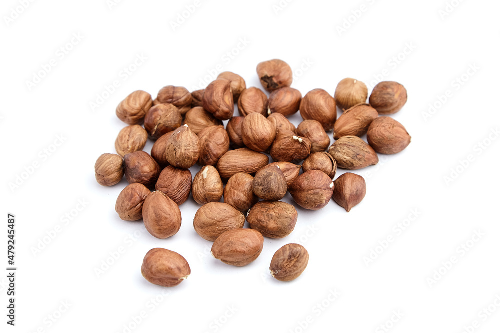 Raw shelled hezelnuts or filberts isolated on white Raw shelled hezelnuts or filberts isolated on white