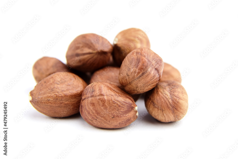 Raw shelled hezelnuts or filberts isolated on white Raw shelled hezelnuts or filberts isolated on white