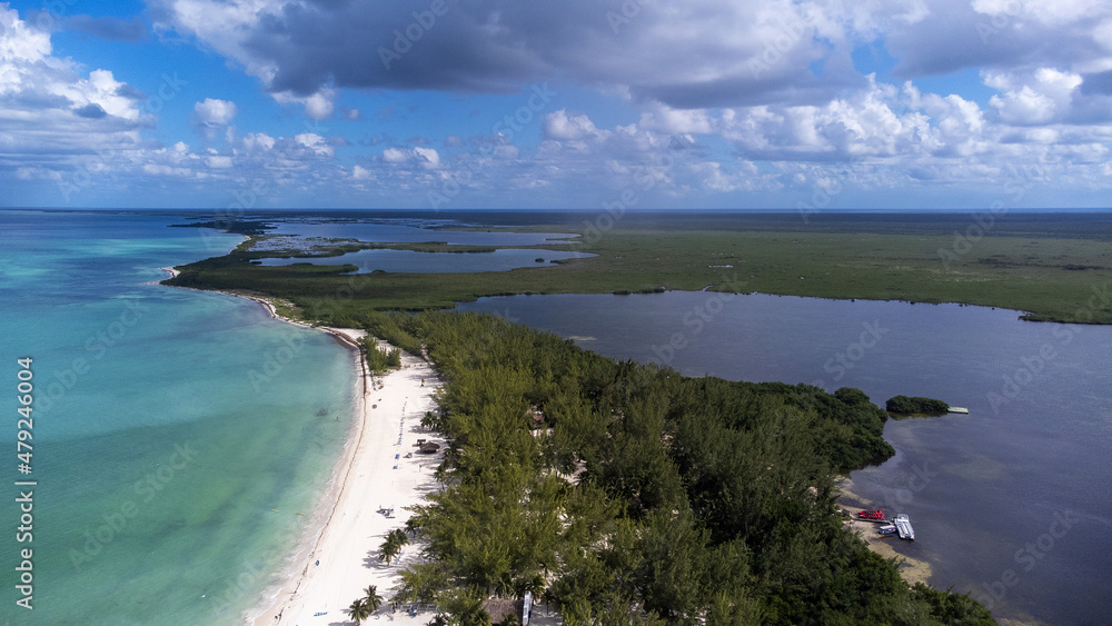 Aerial view of Isla De Pasion aka Passion Island near the tropical island of Cozumel, Mexico in Quintana Roo. The island is surrounded by turquoise water from the Caribbean sea. Aerial view of Isla De Pasion aka Passion Island near the tropical island of Cozumel, Mexico in Quintana Roo. The island is surrounded by turquoise water from the Caribbean sea.