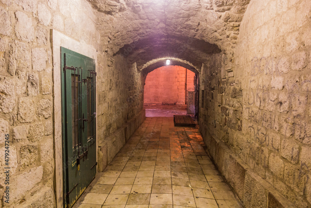 Narrow arched alley in Kotor, Montenegro.