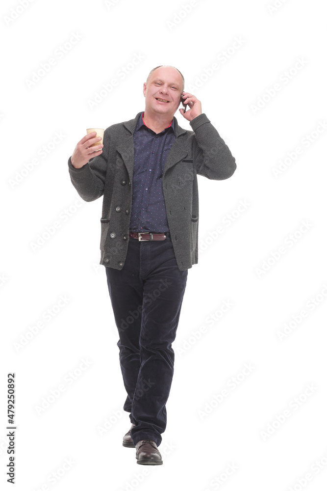 mature smiling man with smartphone and coffee to take away. mature smiling man with smartphone and coffee to take away.
