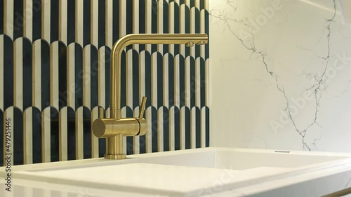 Luxury brass faucet and white marble