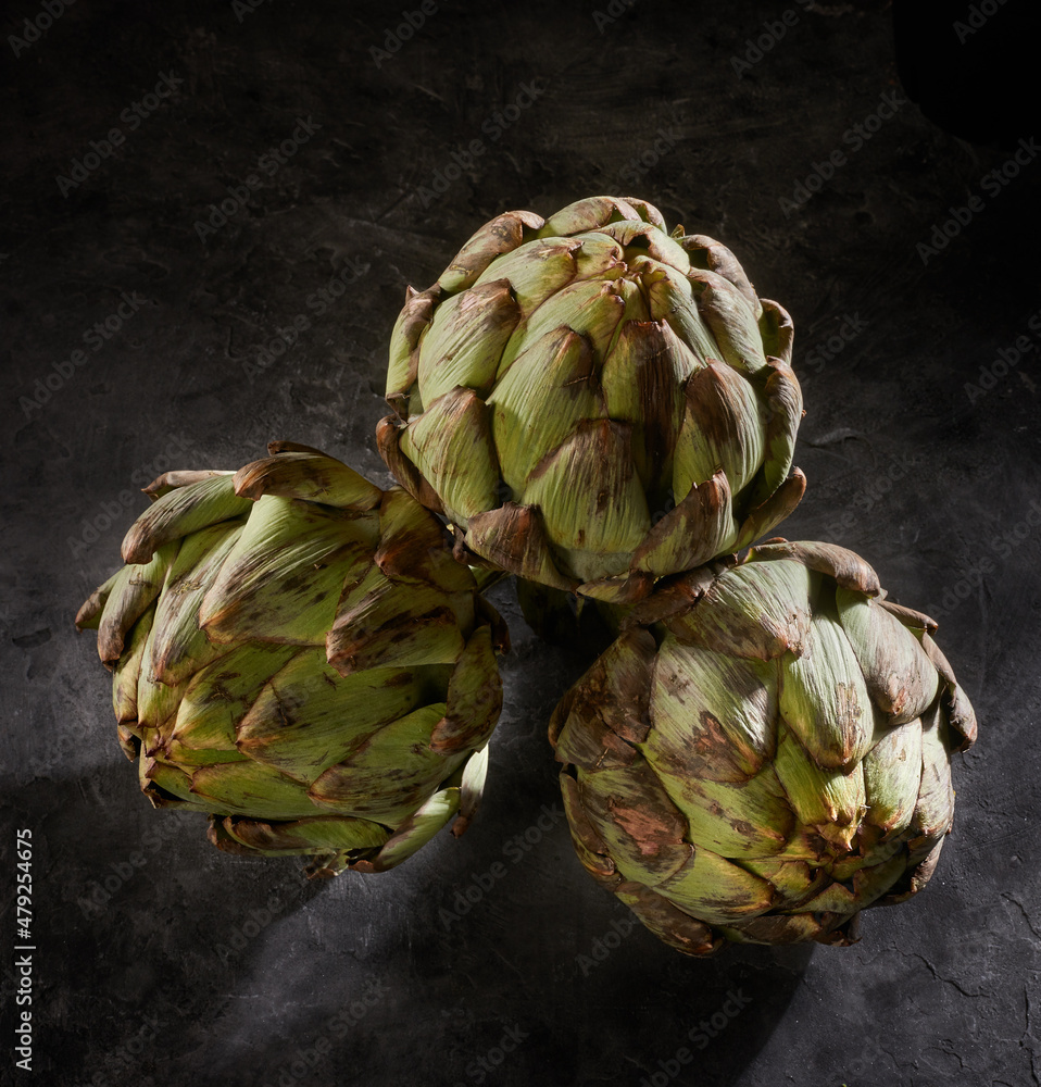 Fototapeta premium artichokes on a dark background