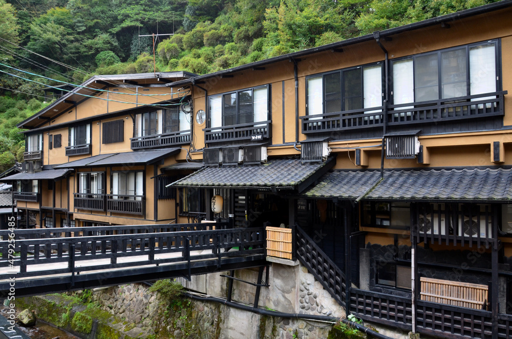 Historical Onsen Ryokan facing river at Aso, Kumamoto, Japan
