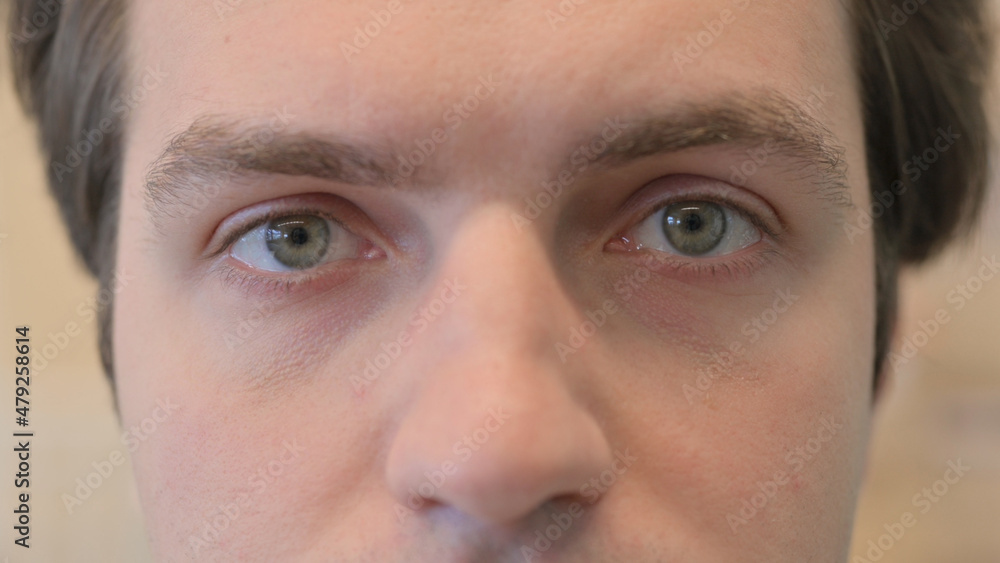 Obraz premium Close up of Blinking Eyes of Young Man