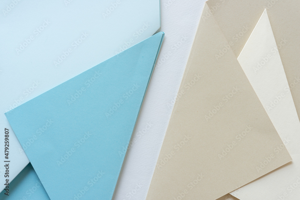 folded paper - blue and beige folded paper - blue and beige