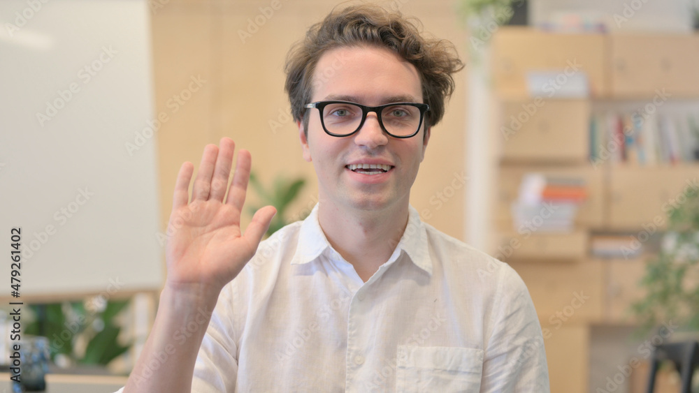 Young Man Waving for Online Video Call Young Man Waving for Online Video Call