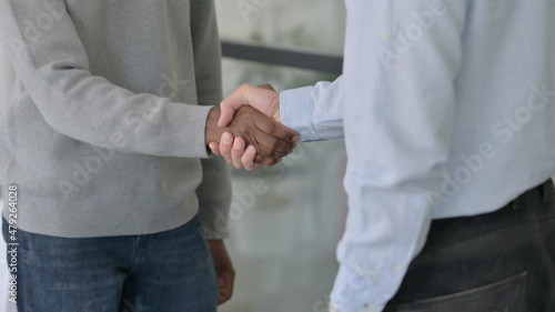 Close up of Handshake between Mixed Race Businessmen