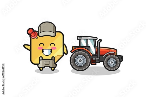 the sticky notes farmer mascot standing beside a tractor