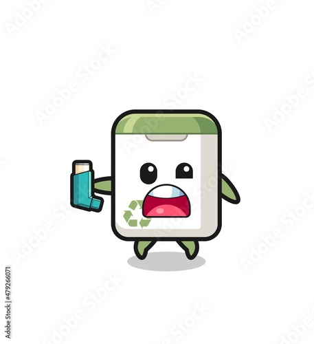 trash can mascot having asthma while holding the inhaler