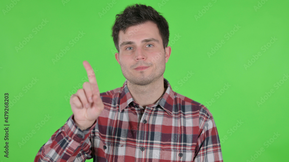 Portrait of Young Man showing No Sign by Finger, Green Chroma Screen Portrait of Young Man showing No Sign by Finger, Green Chroma Screen