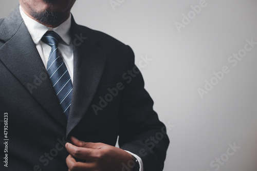 businessman wearing a suit looking professional company executive being a trendsetter courageous attitude
