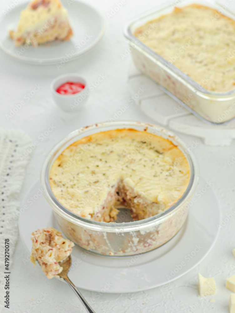 Delicious cheese macaroni mixed with beef and sausage topped with sauce Delicious cheese macaroni mixed with beef and sausage topped with sauce
