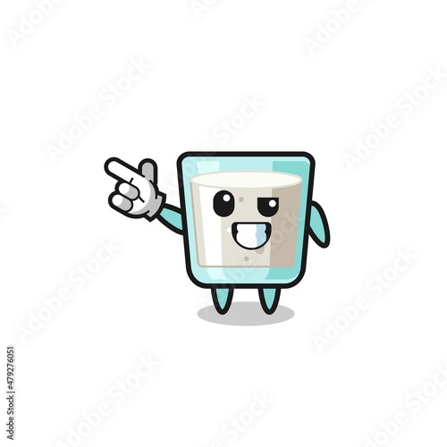milk mascot pointing top left