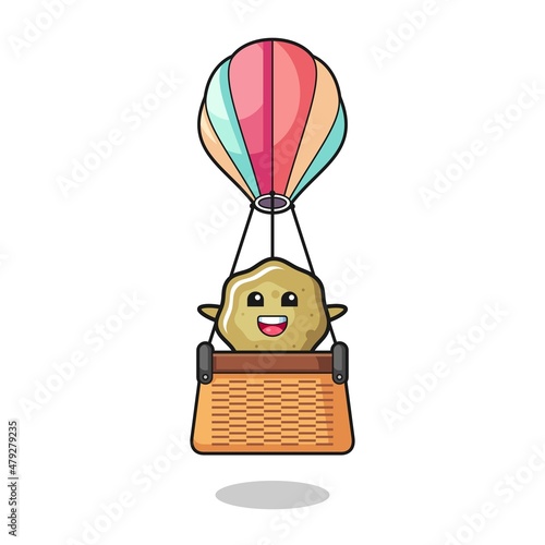 loose stools mascot riding a hot air balloon