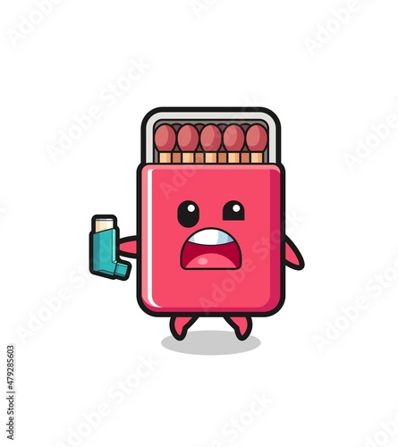 matches box mascot having asthma while holding the inhaler