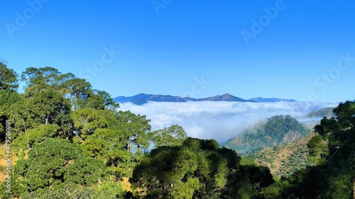 Mountain top view with clouds touching the mountain in lower Himalayas.